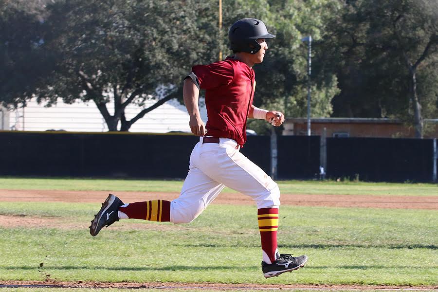Andres Kim scores one of the team's 66 runs thus far in six wins, photo by Richard Quinton.