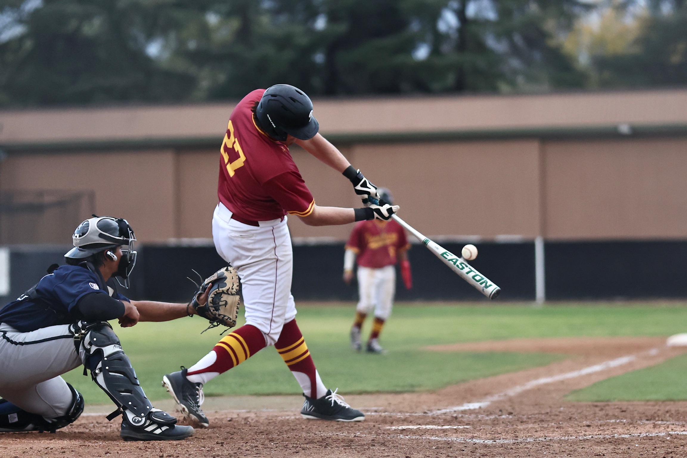 Patrick Garcia rips one of three consecutive home runs by PCC in the second inning of its win over Citrus on Tuesday (photo by Michael Watkins).