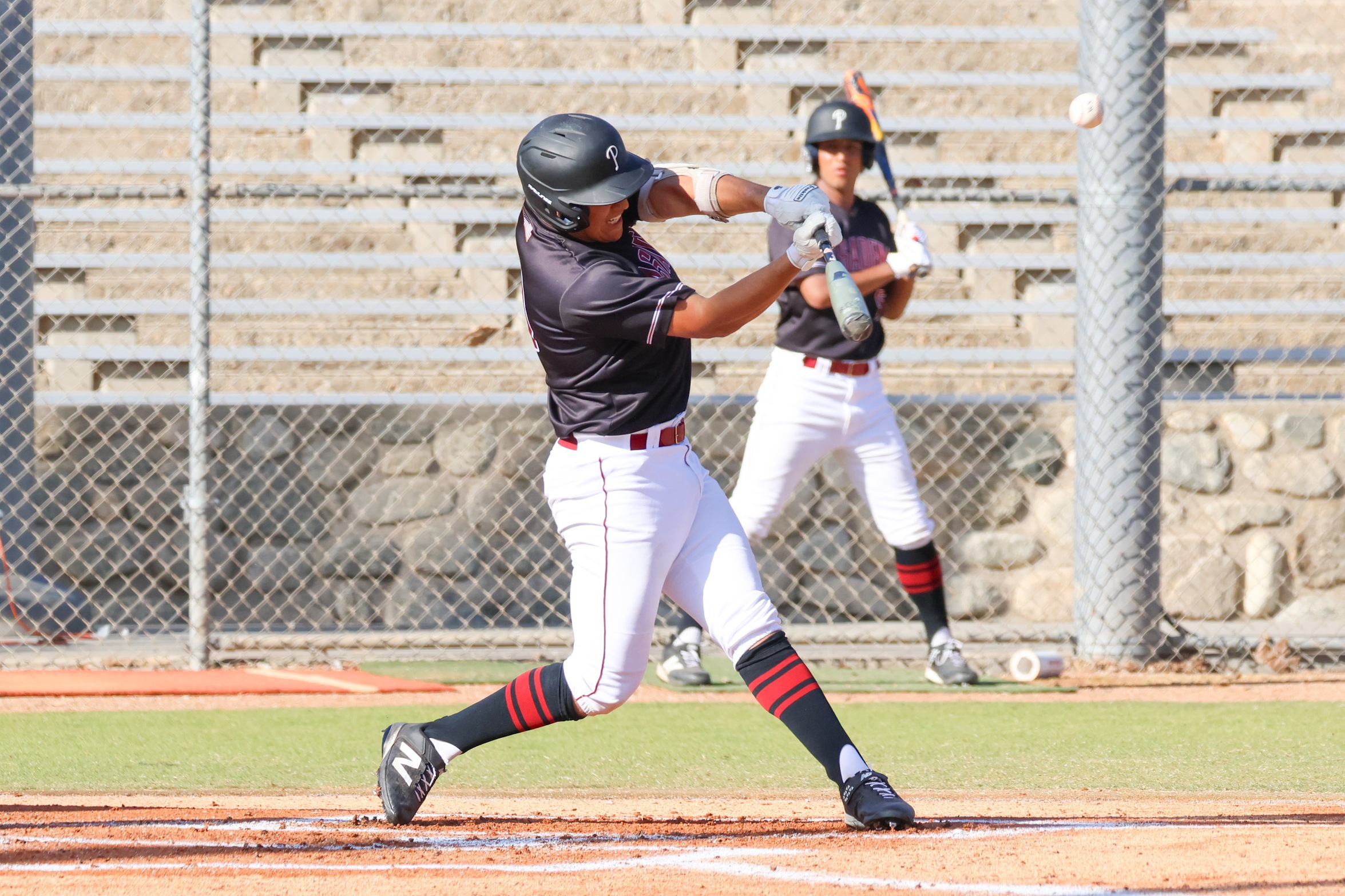 Jacob Escamilla drives a double in PCC's win on Friday (photo by Richard Quinton).