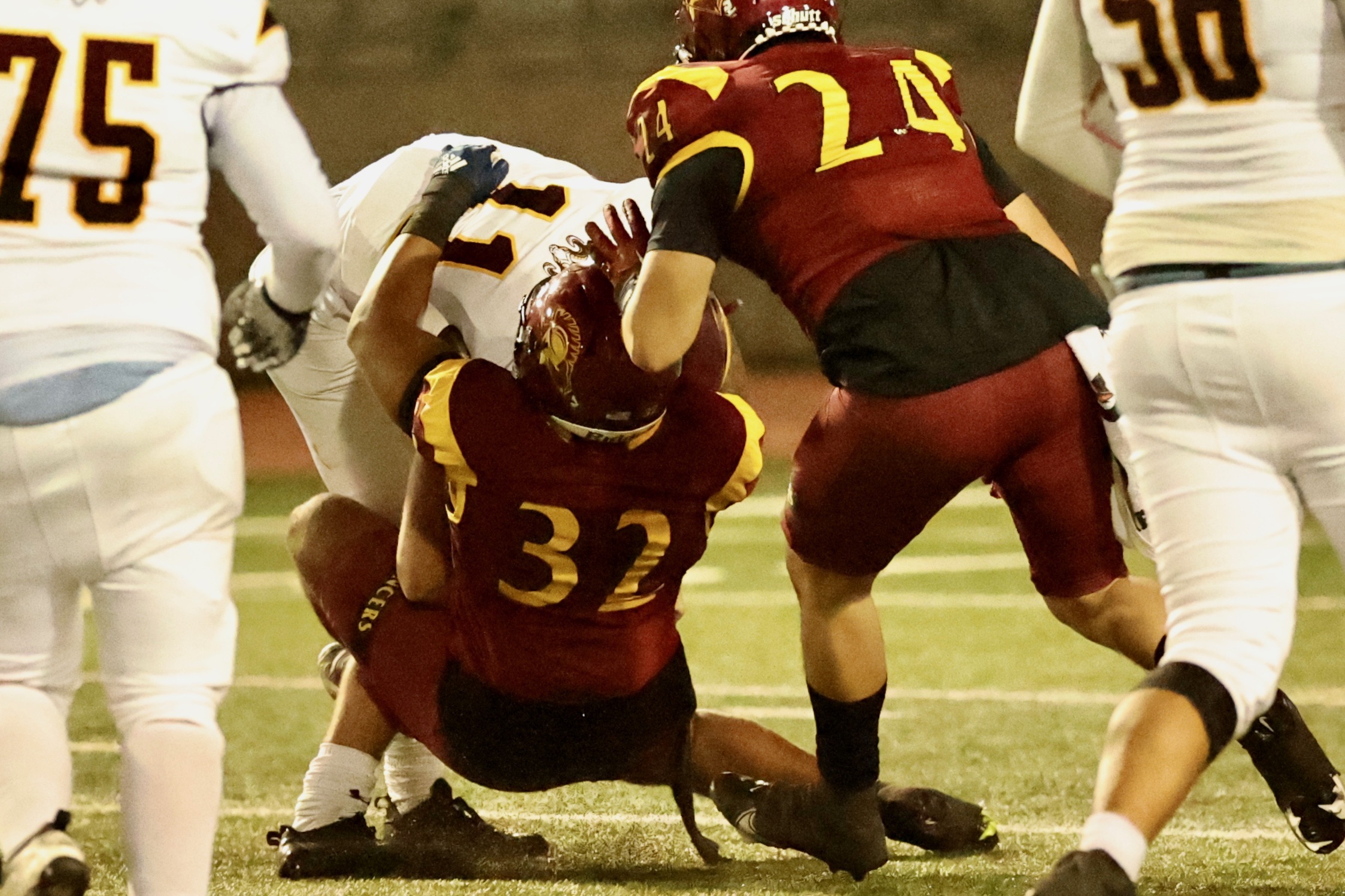Jordan Monroe with one of his four QB sacks as Carlos Ramirez helps out during PCC's win on Saturday (photo by Michael Watkins).