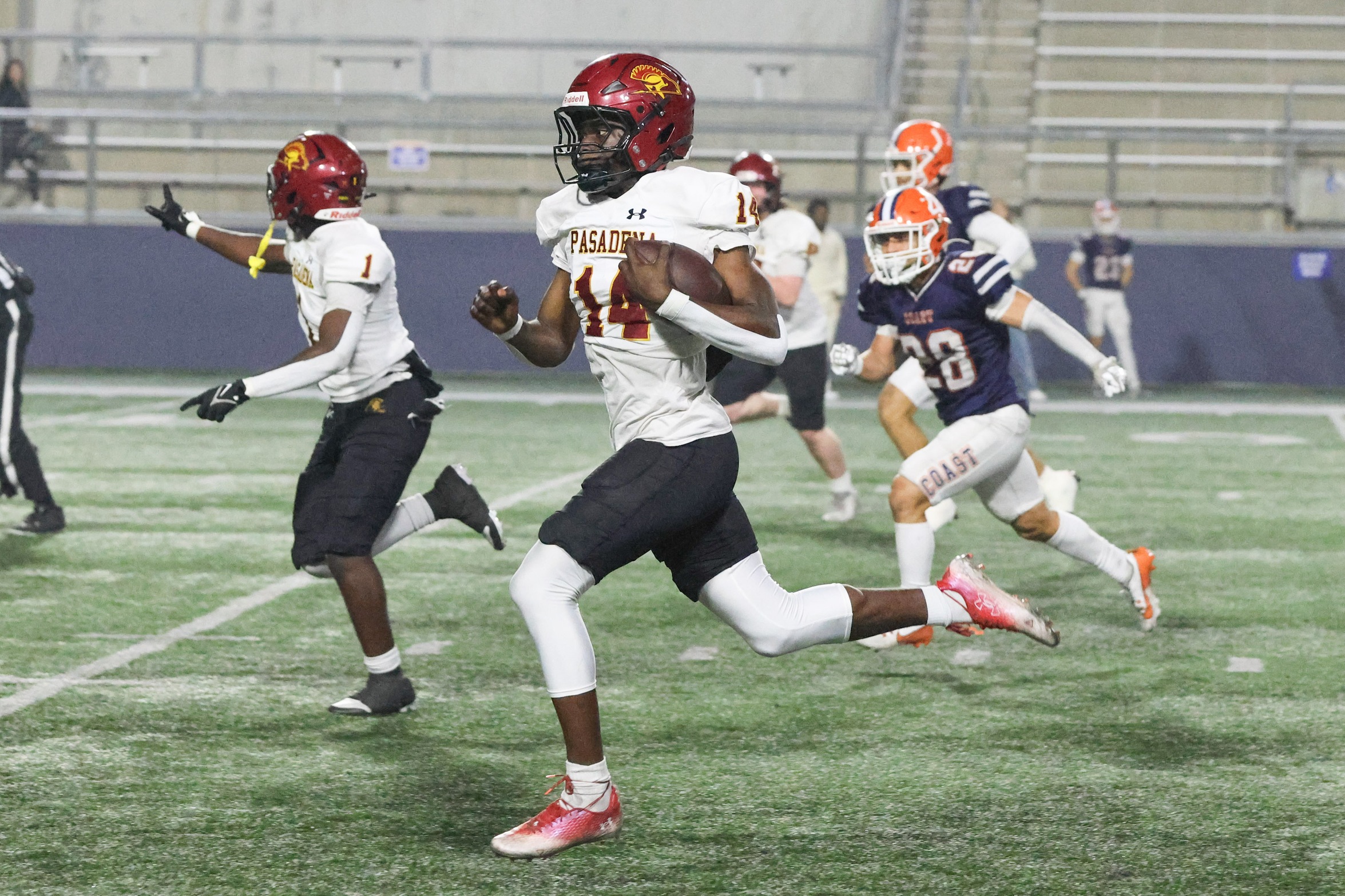 Kim Aseh returns an interception for a touchdown at Orange Coast on Saturday (photo by Richard Quinton).