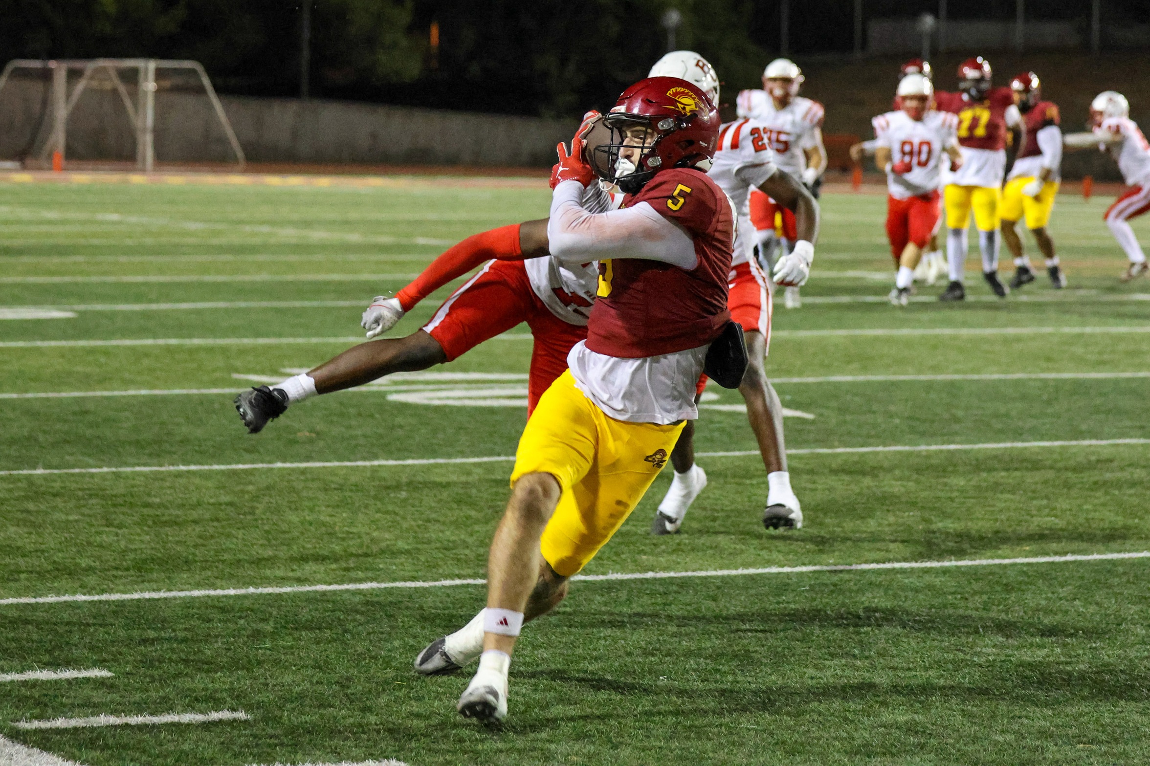 Maddux Mateski makes a circus catch on his way to a 45-yard touchdown in PCC's wild win over Bakersfield on Saturday (photo/gallery by Richard Quinton).