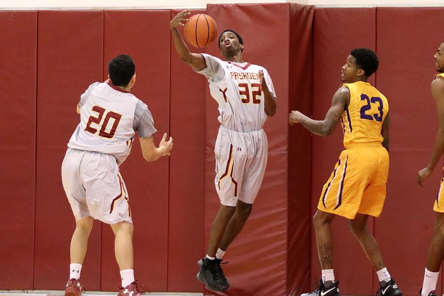Lancer Levi James grabs the rebound with teammate Jacob Lomeli (20) aiding on the play on Wednesday, photo by Richard Quinton.