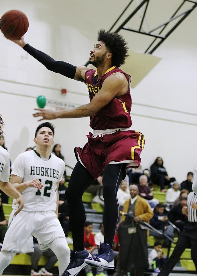 Todd Barnes goes up for a layup as part of his 30 points in the Lancers season finale Friday night at East Los Angeles College, photo by Richard Quinton.
