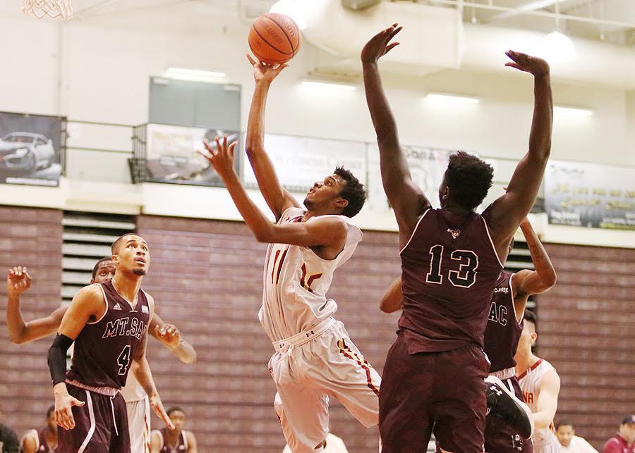 Lancers forward Ivan Egbunike, son of PCC track and field/cross country coach Innocent Egbunike, goes up for a shot attempt on Wednesday evening.