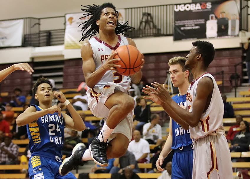 Frosh guard Anthony Evans drives to the basket during PCC's opening game of the Skip Robinson Classic Thursday night, photo by Richard Quinton.