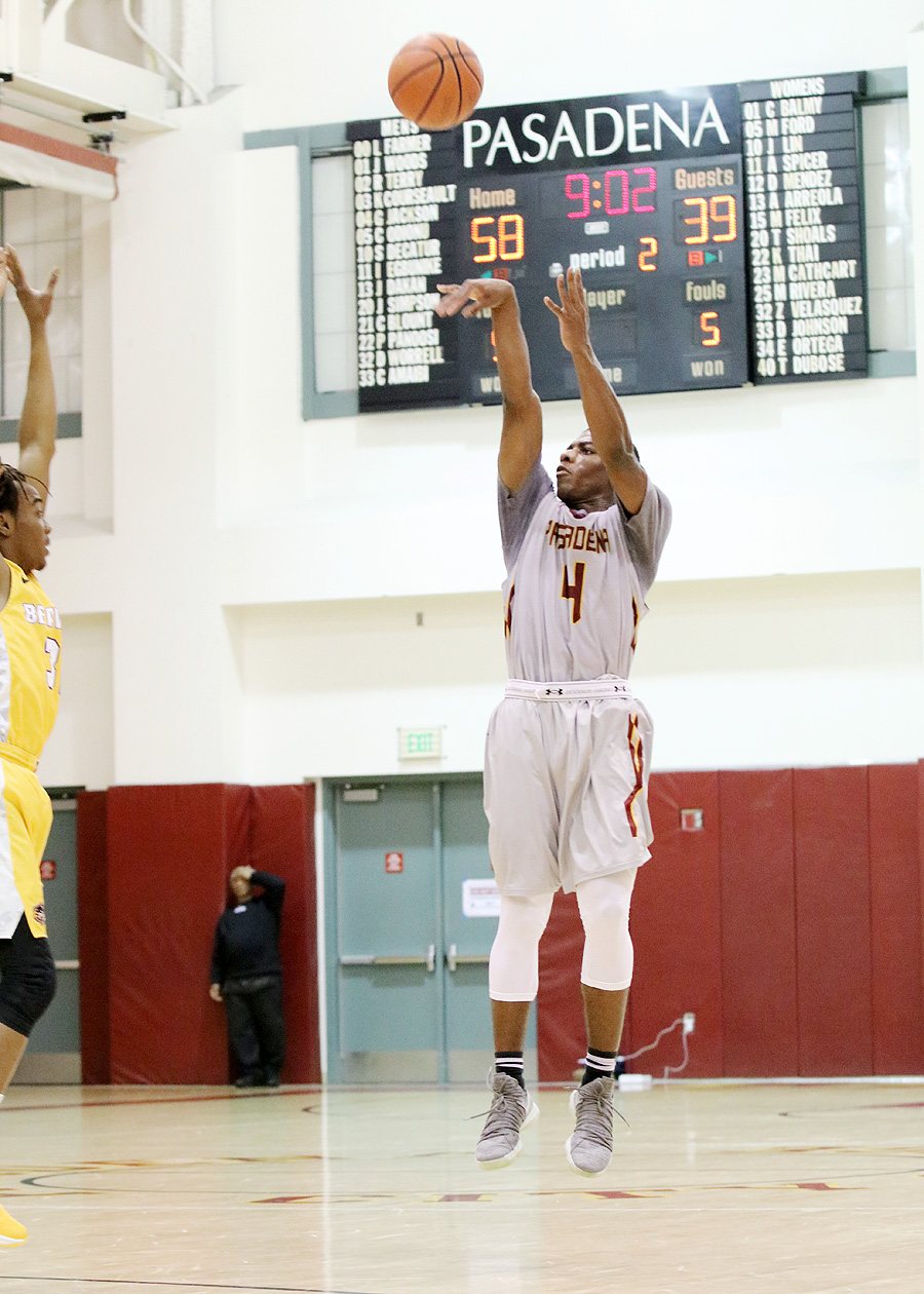 The scoreboard tells the story as Giovonni Jackson launches a basket during the Lancers home romp over Trade Tech Wednesday evening, photo by Richard Quinton.