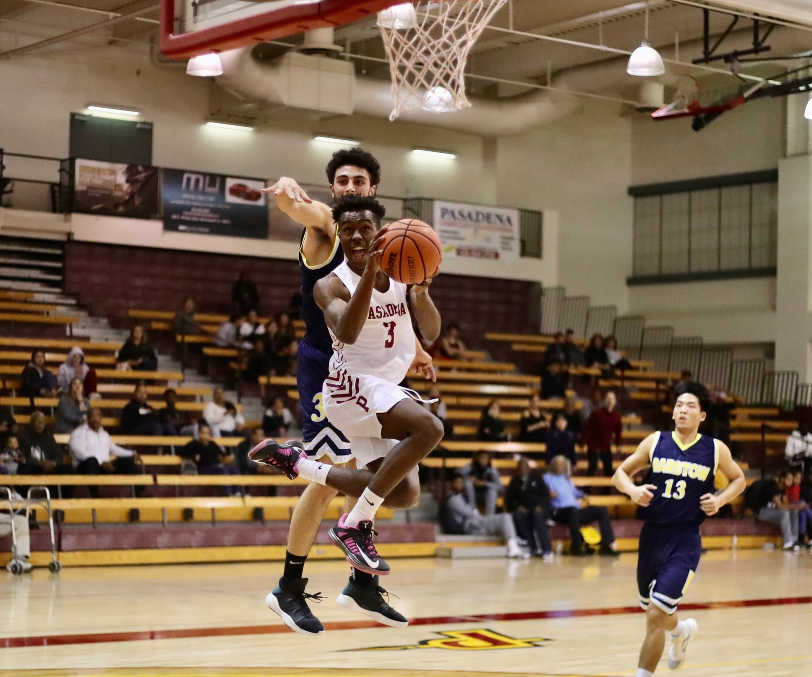 Rasheet Wilson drives to the basket during PCC's win on Thursday during the Skip Robinson Classic, photo by Michael Watkins.