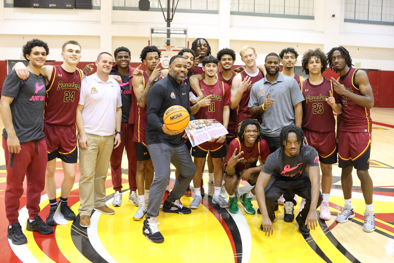 Coaach Frazer with his players and assistant staff following his 100th career victory (photo by Richard Quinton).