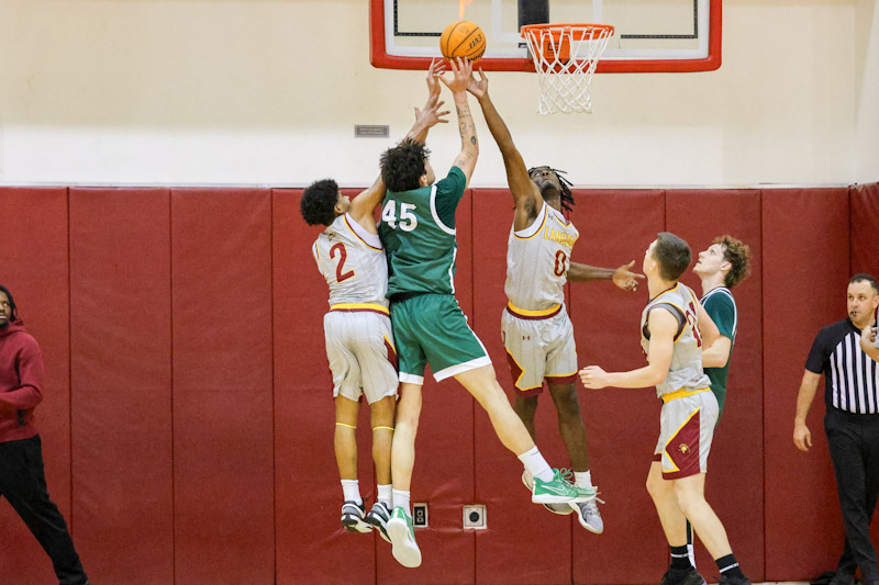 Dylan Swillis goes up for the ball with teammate Darrius Freeman in PCC's Round 1 playoff win (photo by Richard Quinton).