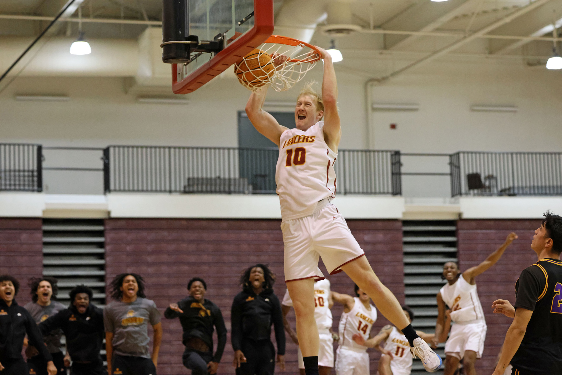 Cooper Creamer with the dunk during PCC's loss on Friday (photo/gallery by Richard Quinton).