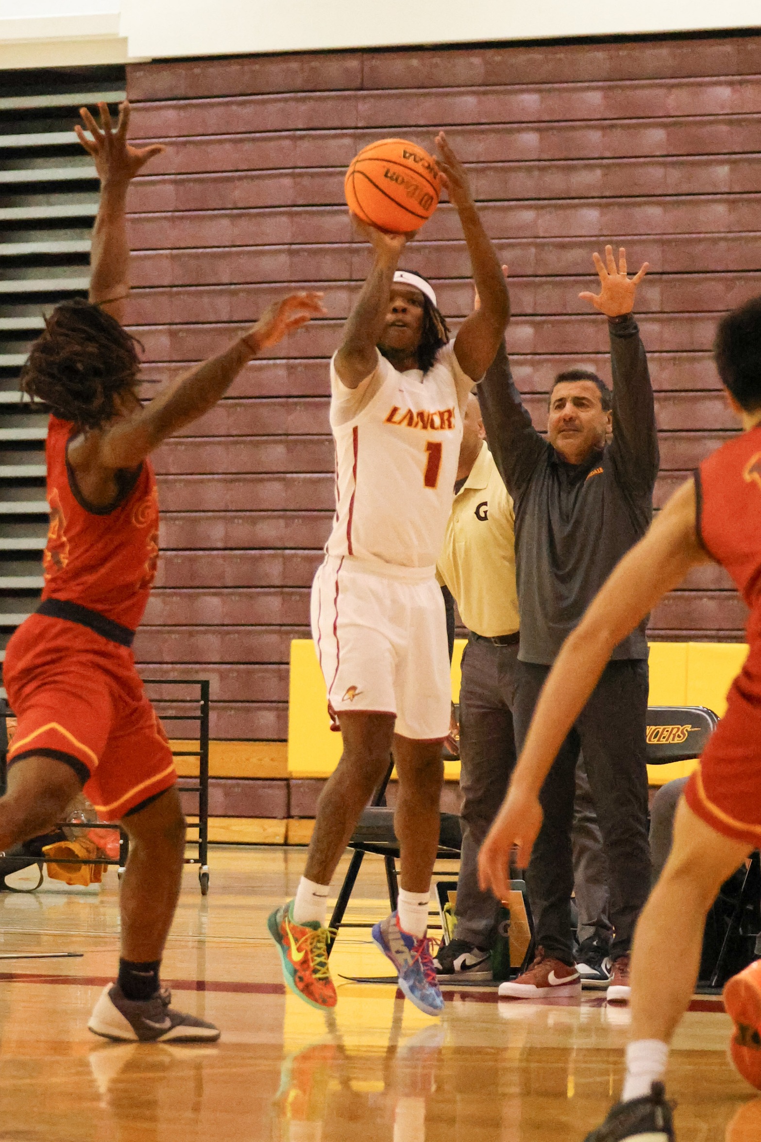 Brandin Jackson puts up a shot v. Glendale on Saturday (photo by Richard Quinton).