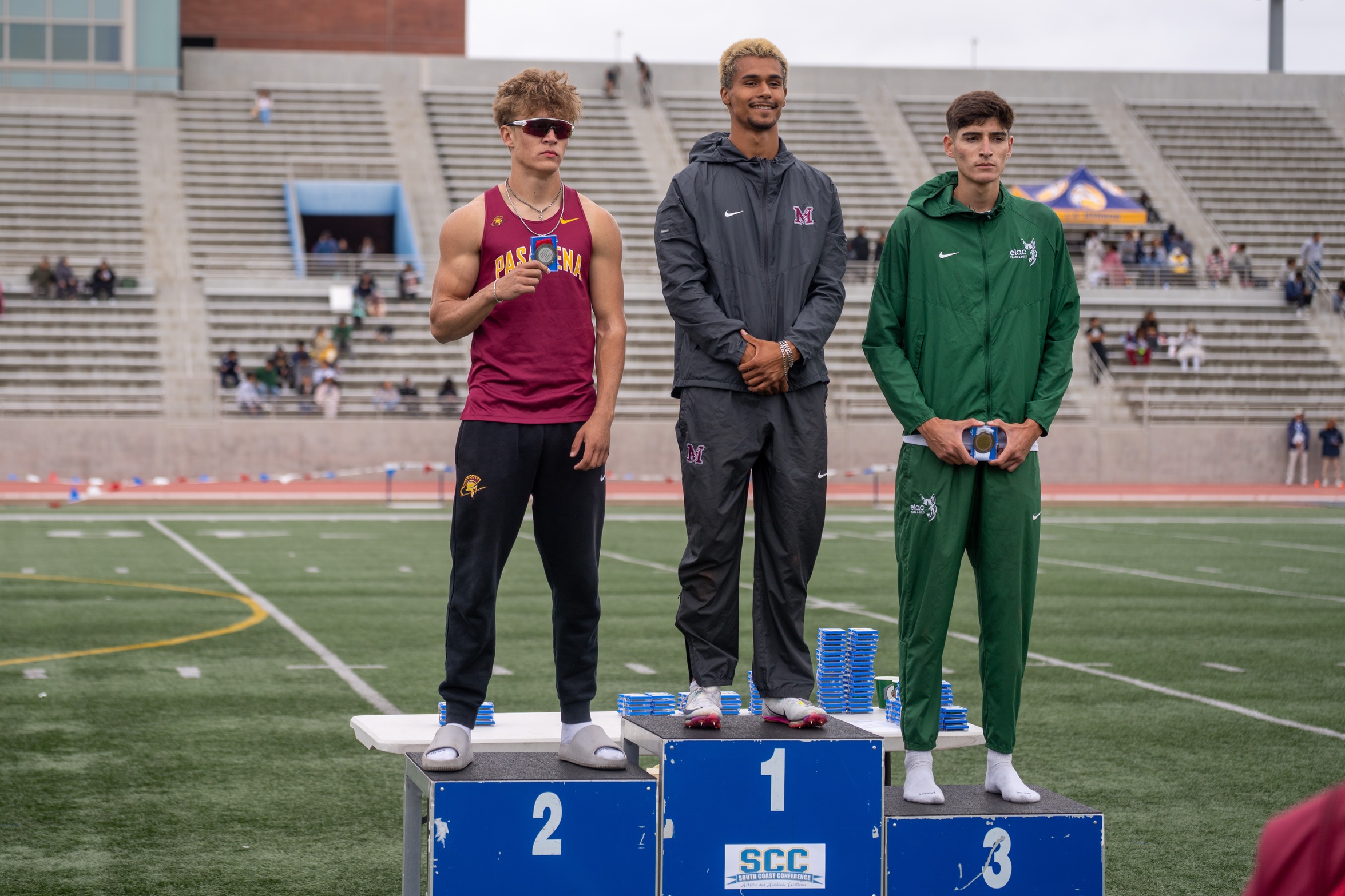 Morgan Strauss (left) with his second-place medal in the 400 meters (photo courtesy of El Camino College Athletics).