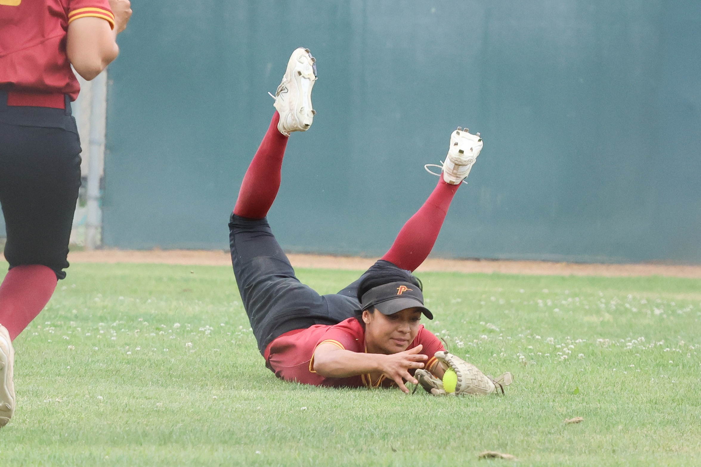 PCC centerfielder Marissa Moreno makes a diving catch at East LA (photo by Richard Quinton).