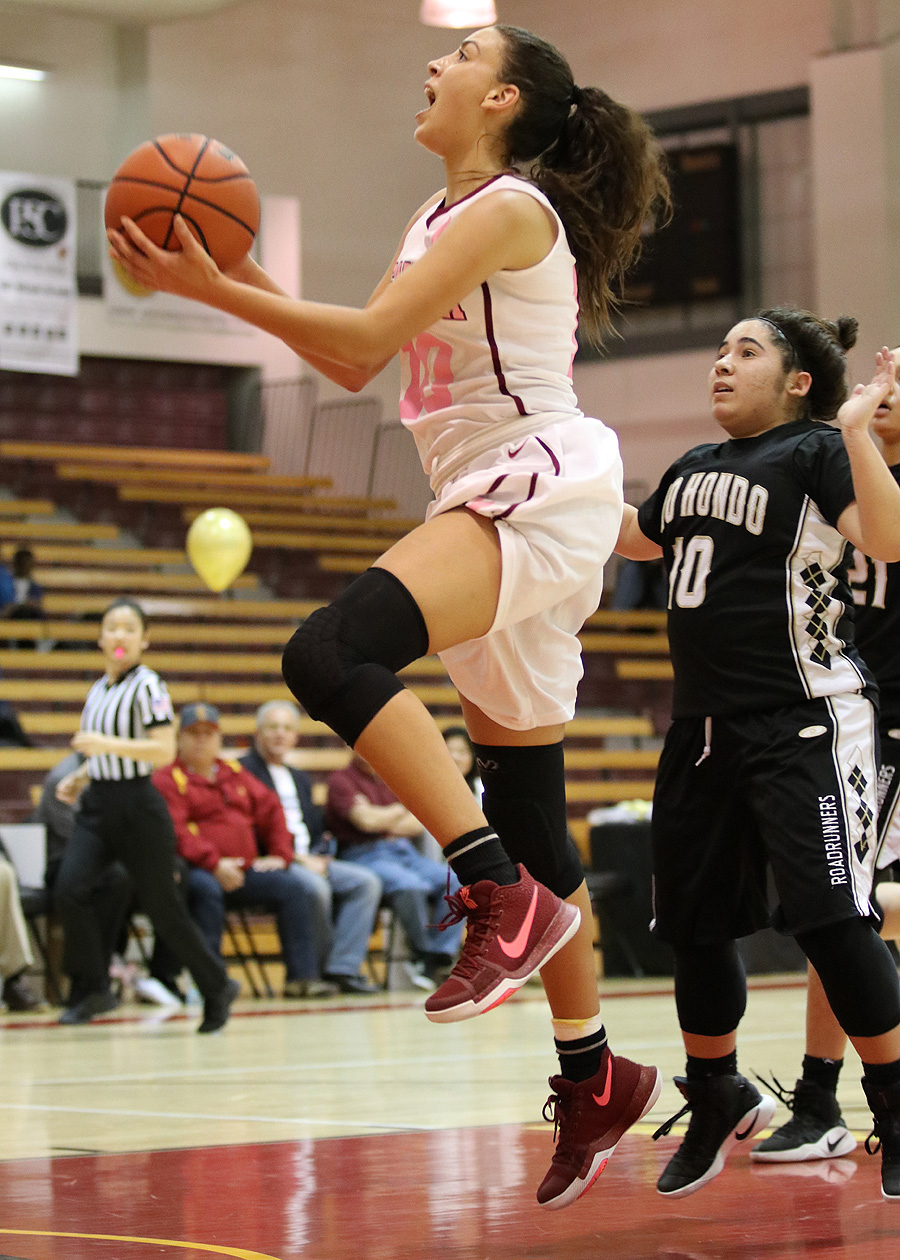 Jolene Robinson goes up for a layup as PCC won its 20th game in the 2016-17 season Wednesday night in the team's home finale, photo by Richard Quinton.