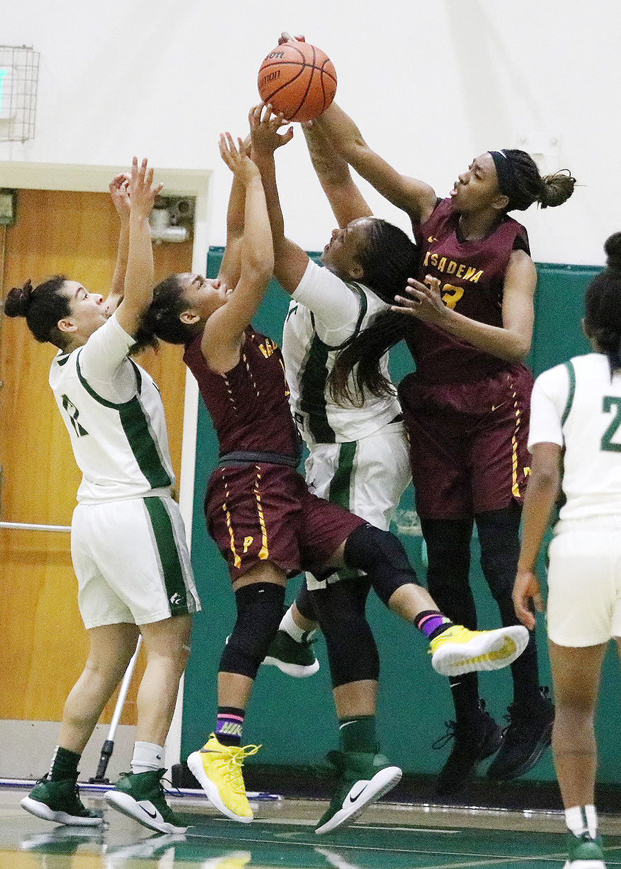 Dariel Johnson (right) and Cosette Balmy (left) battle for the ball during the Lancers Round 3 Regional final playoff loss at East Los Angeles College, photo by Richard Quinton.