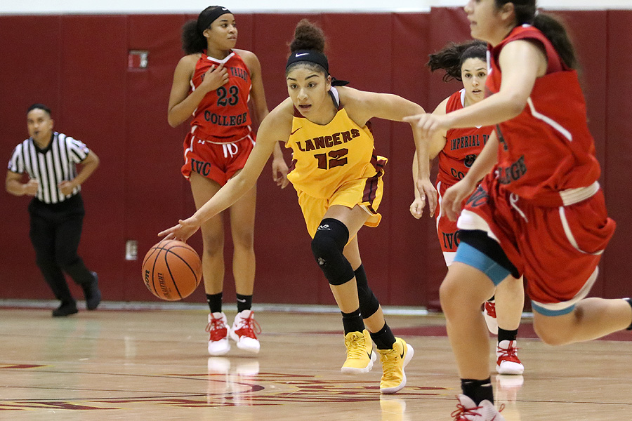 Lancer Daniela Mendez dribbles up the court during PCC's home-opening win Thursday night over Imperial Valley, photo by Richard Quinton.