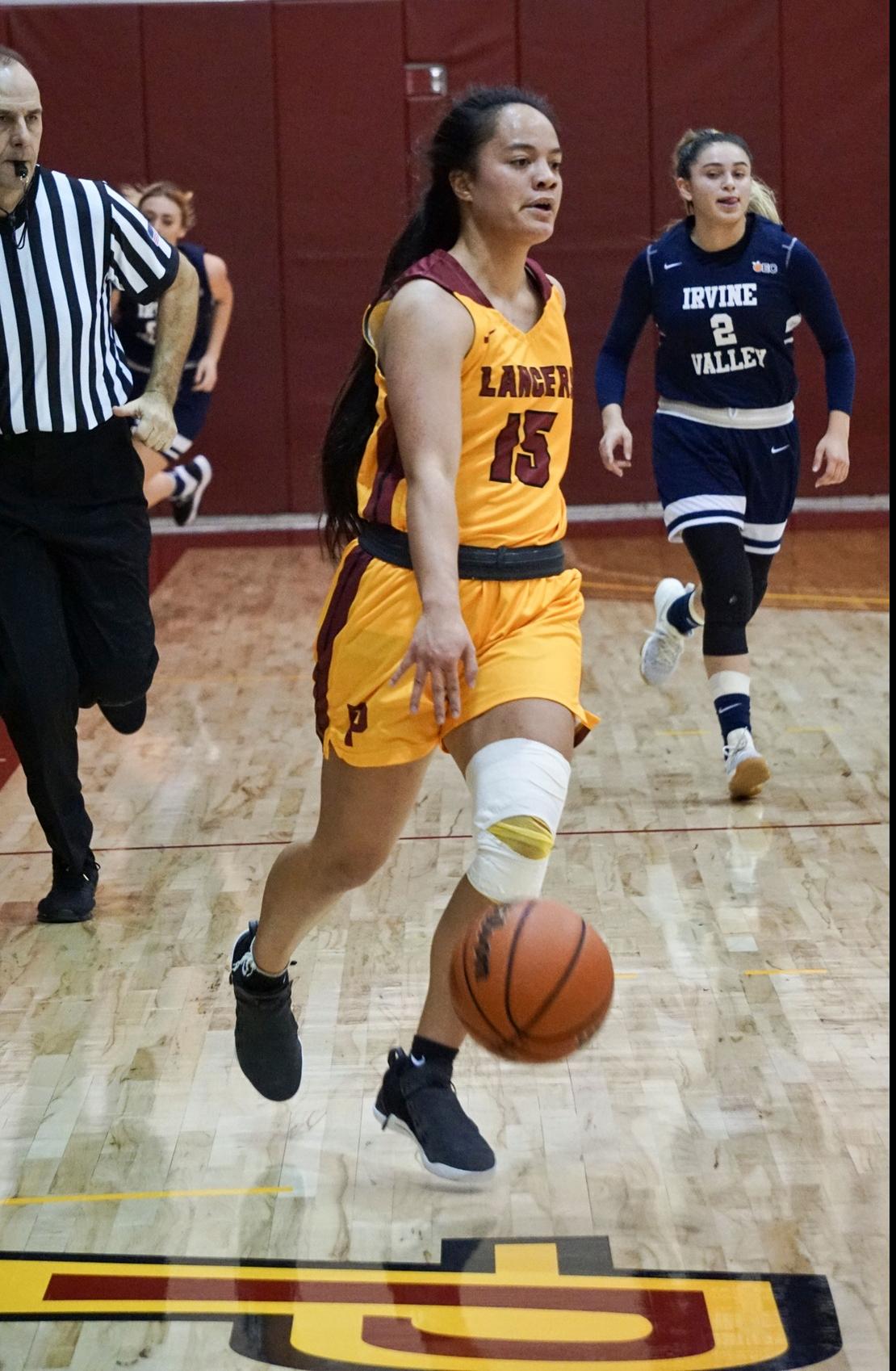 Lancer Merina Latu in action in a December home game, photo courtesy of Ken McLin.