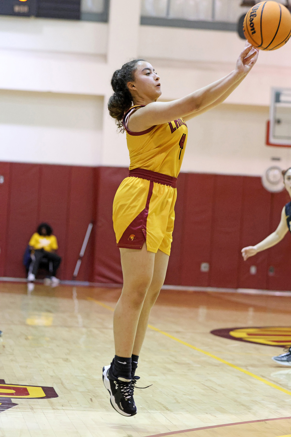 Salia Baligh launches the 3-point basket, one of a season-high 12 by the Lancers on Friday night (photo by Richard Quinton).