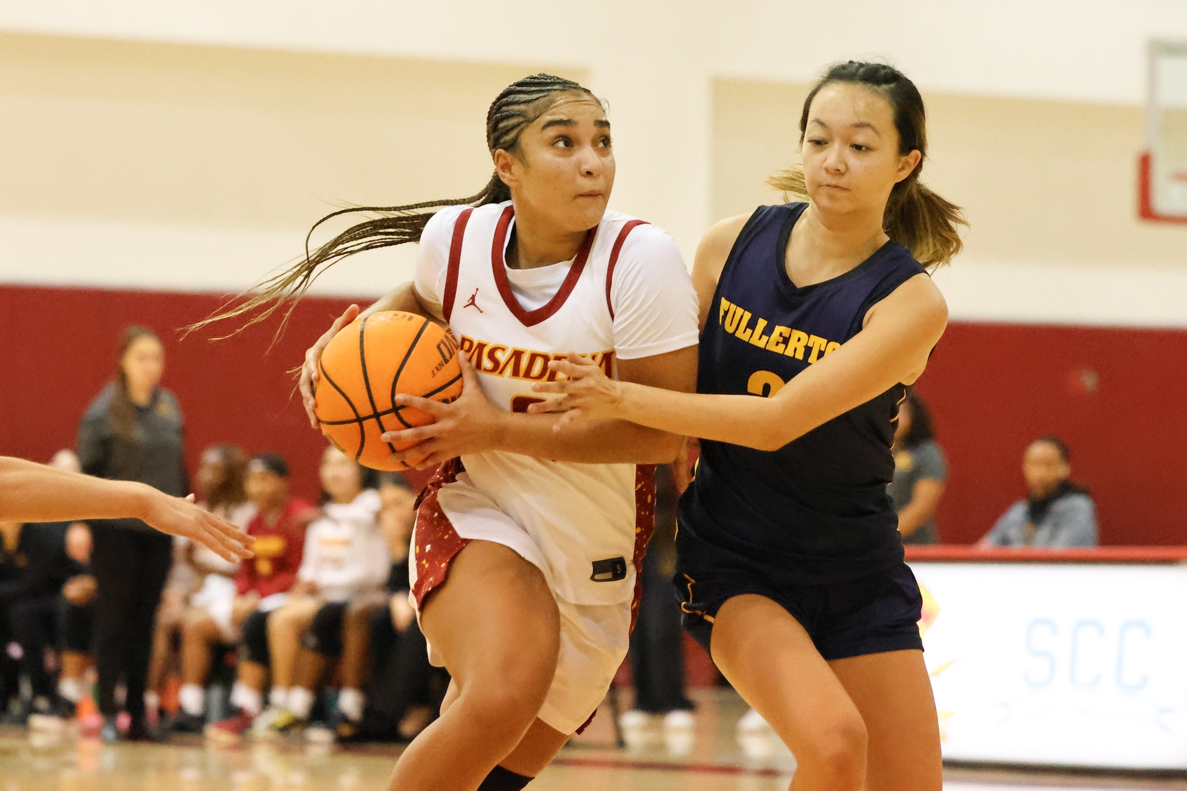 Monica Menzies goes to the basket v. Fullerton (photo by Richard Quinton).