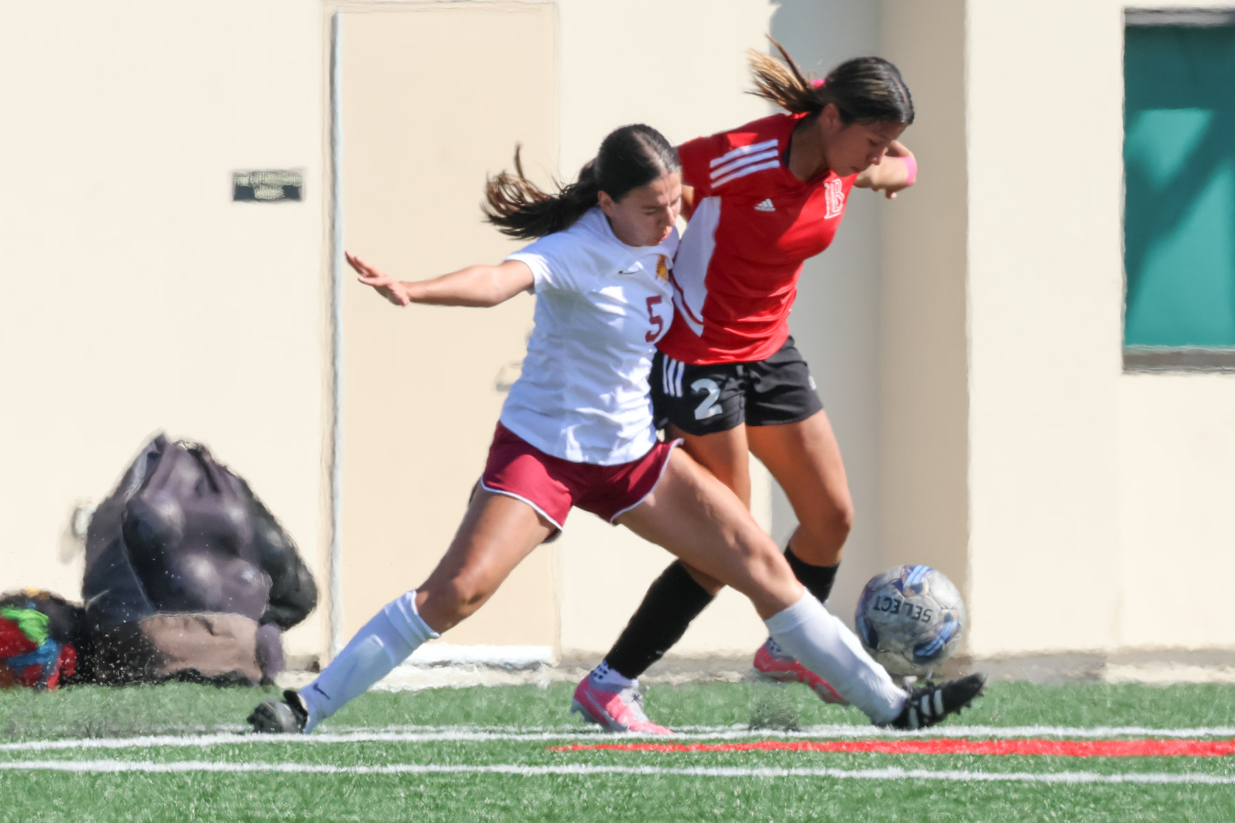 Bertha Guzman battles a Long Beach player during Tuesday's loss (photo by Richard Quinton).
