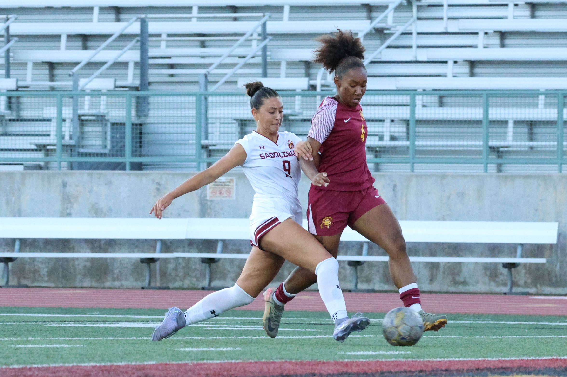 Lancer Raylyn Laney tries to get free on this play in Friday's game (photo by Richard Quinton).