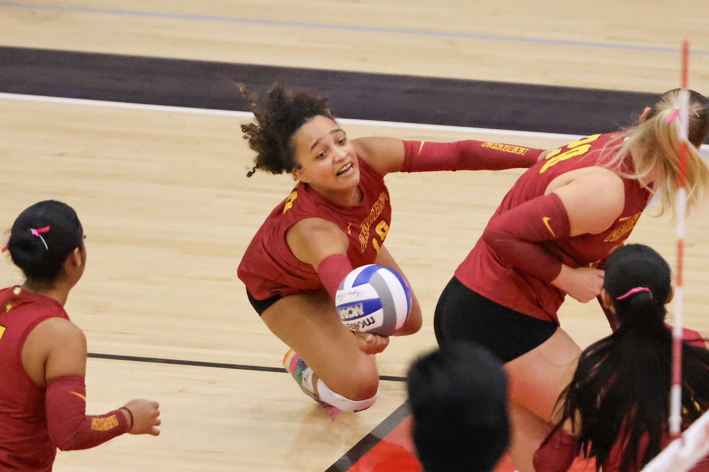 Izzy Taylor with a saving dig at Long Beach (photo by Richard Quinton).